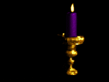 a purple candle in a gold candle holder