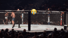 a referee stands in a boxing ring with a tear coming out of his eyes