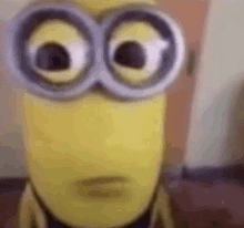 a close up of a minion wearing goggles .