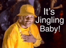 a man wearing a yellow hat and a yellow shirt with the words `` it 's jingling baby '' .