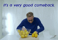 a man in a blue shirt is cutting lemons in front of a sign that says it 's a very good comeback