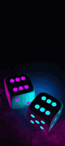 a pair of dice that are glowing in the dark with the number six on them