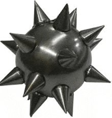 a close up of a black ball with spikes on it on a white background .