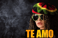 a woman with dreadlocks wearing a rasta hat and sunglasses says " te amo " in yellow