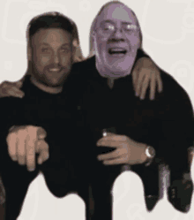 a man with a purple face is holding another man