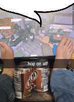 two cans of root beer sit on a table next to a person 's feet in front of an insignia monitor