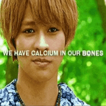 a young man with the words we have calcium in our bones