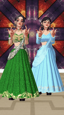 a woman in a green dress and a woman in a blue dress