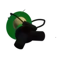 a green and black object with a yellow ball inside