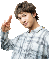 a man wearing a plaid shirt that says babe vegout at home gives the peace sign