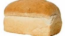 a loaf of white bread is sitting on a table on a white background .