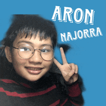 a boy with glasses and the name aron majorra on the bottom