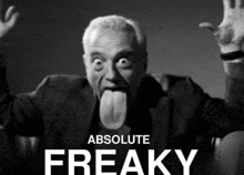 a black and white photo of a man sticking his tongue out with the words absolute freaky behind him