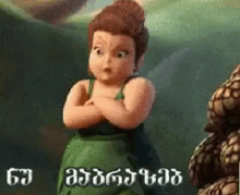 a cartoon girl in a green dress with her arms crossed is standing next to a pile of pine cones .