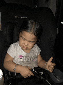 a baby is sitting in a car seat that says babytrend