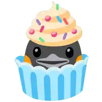 a penguin with a cupcake on top of it 's head