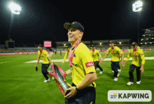 a man wearing a yellow shirt that says value on it