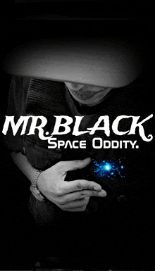 a black and white photo of a man with the words mr.black space oddity