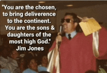 a man speaking into a microphone with a quote from jim jones behind him