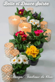 a display of flowers and candles with belle et douce soiree written on the top