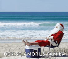 santa is sitting on the beach with his feet on a cooler