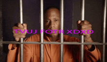 a man in a jail cell with the words tvuj fotr xdxd behind him