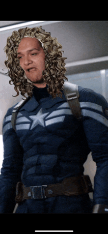 a man in a captain america costume with curly hair