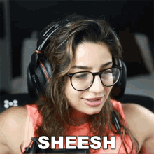 a woman wearing glasses and headphones has the word sheesh above her head