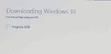 a screen that says downloading windows 10 feel free to keep using your pc progress : 83%