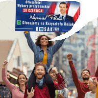 a group of people holding up a sign that says wybory prezydenckie