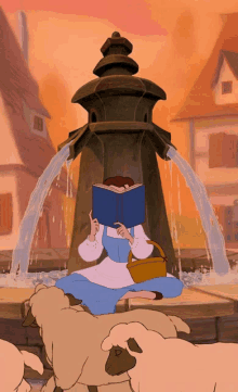 belle from beauty and the beast is reading a book