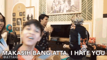 a group of people are dancing in a living room with the words " makasih bang atta i hate you "