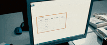 a computer monitor displays a table with chinese characters on it