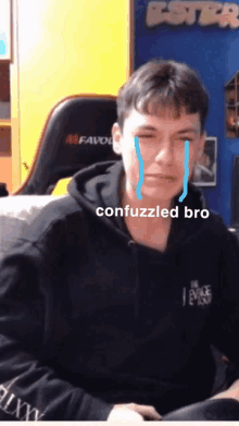 a man in a black hoodie is crying with the words " confuzzled bro " on the bottom