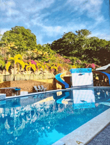 a swimming pool with a slide and a sign that says 4