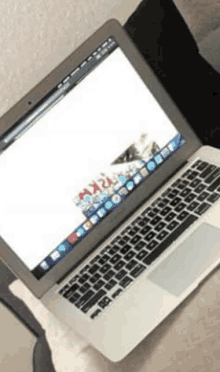 a macbook air laptop is open to a screen that says rkp on it