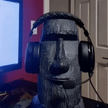 a statue with headphones and a microphone on top of it