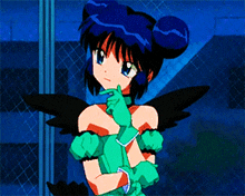 a girl with blue hair and black wings is wearing a green glove