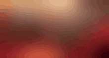 a blurred image of a red and brown background with a gradient