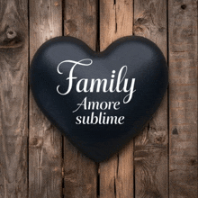 a black heart that says family amore sublime