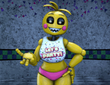 a yellow toy with a shirt that says let 's party on it