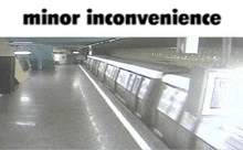 a train is going down the tracks at a subway station with a caption that says minor inconvenience .