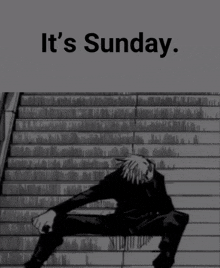 a man sits on a set of stairs with the words it 's sunday below him