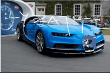 a picture of a blue sports car with the word lyzatt written on it