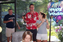 a man wearing a shirt that says abercrombie is standing next to a woman