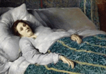 a painting of a woman laying on a bed