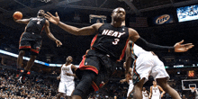 a basketball player with the number 3 on his jersey jumps in the air