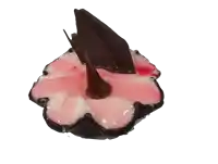 a pink and white flower shaped dessert with a chocolate leaf on top