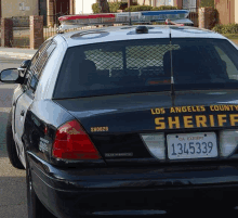 a los angeles county sheriff car with a license plate that says 1345335