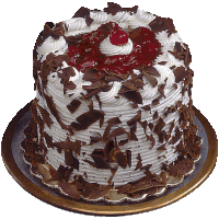 a black forest cake with chocolate shavings on top